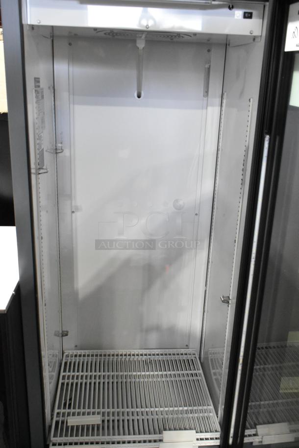 2025 True GDM-12-HC commercial reach-in cooler, single door, metal frame, poly-coated racks, 115V, excellent condition.