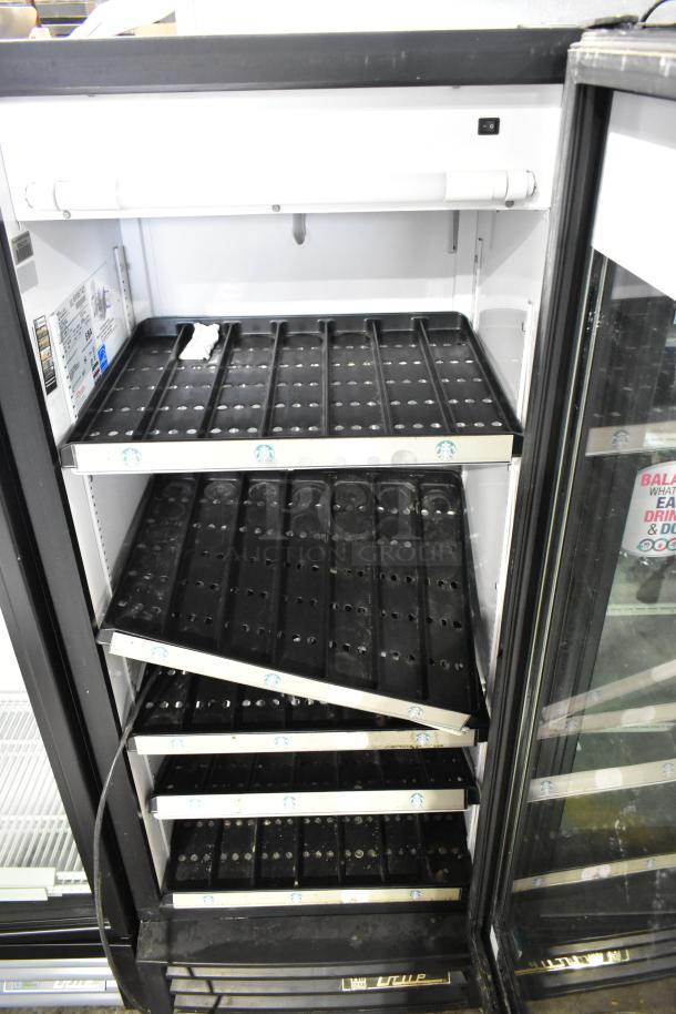 True GDM-12 commercial cooler, single door, poly-coated racks, 115V, 1 Phase, model label visible.