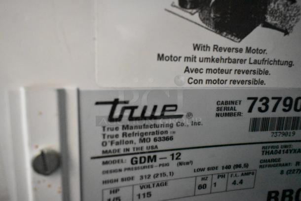 True GDM-12 commercial cooler label, indicating reverse motor feature, voltage of 115 volts, and 1 phase power.