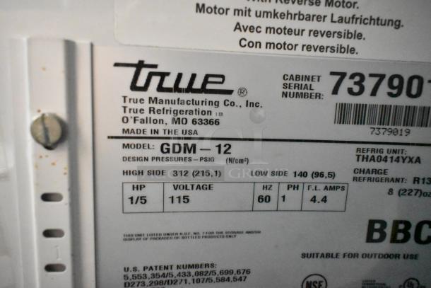 True GDM-12 metal cooler label, 115 volts, 1 phase, for commercial use, with NSF certification and U.S. patent numbers.