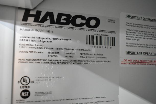 2019 Habco SE18 metal commercial single door reach-in cooler, poly coated racks, 115 volts, 1 phase. Labels show model and specs.