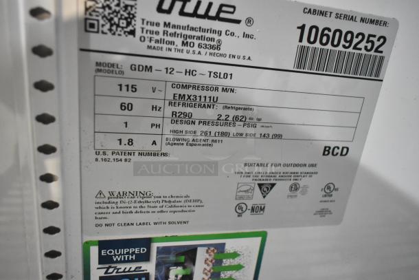 Label of 2023 True GDM-12-HC single door cooler, 115V, 1-phase, with R290 refrigerant and features warnings and serial details.