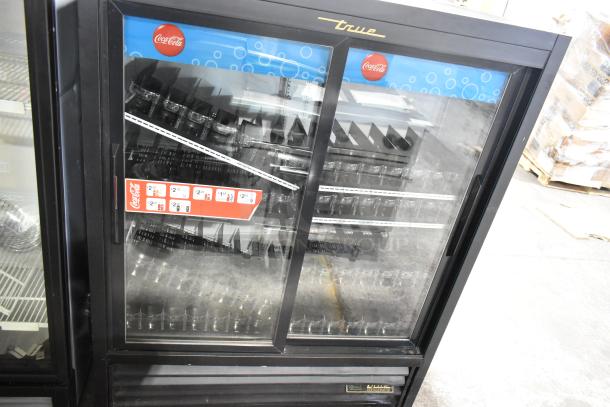 2016 True GDM-41SL-60-HC-LD 2 Door Reach-In Cooler, black with poly-coated racks, 115V, 1 Phase, Coca-Cola branding.