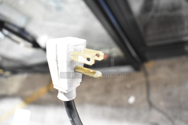 Close-up of a power plug for a 2016 True GDM-41SL-60-HC-LD 2 Door Reach In Cooler Merchandiser, 115 Volts, 1 Phase.