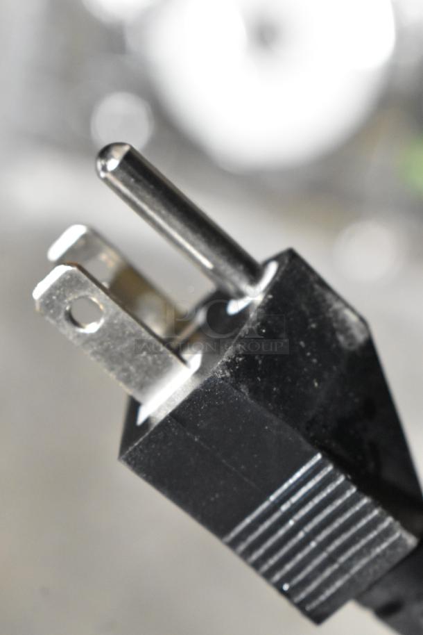 Close-up of the plug for a Vacmaster VP215 Stainless Steel Commercial Countertop Chamber Vacuum Sealer, 120 Volts.