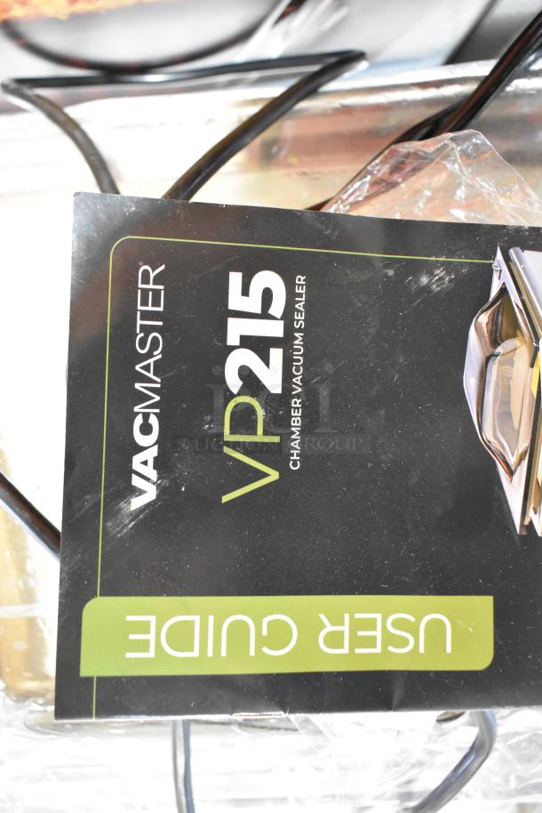 Vacmaster VP215 stainless steel chamber vacuum sealer. Includes user guide. 120 volts, 1 phase. Commercial countertop model.