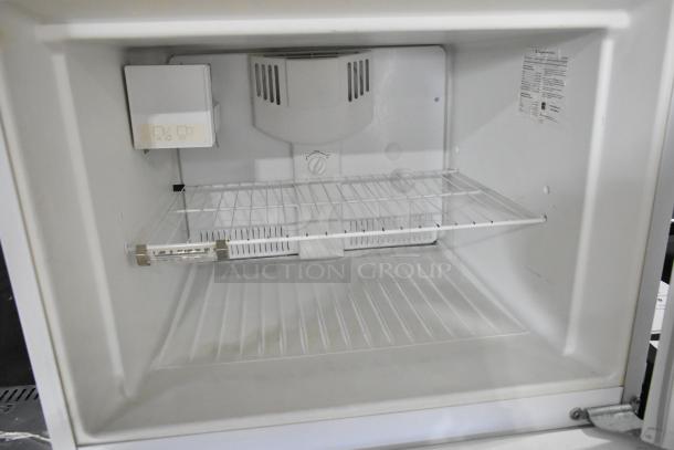 Electrolux Reach In Cooler-Freezer, model FRT21IL6JW2, 115V, 1 phase, clean interior, adjustable shelf, control knobs visible.
