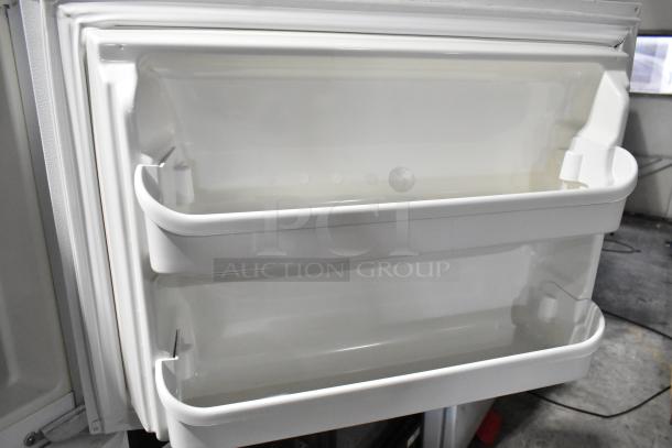 Electrolux FRT21IL6JW2 reach-in cooler door interior, showing spacious white plastic shelves. 115 Volts, 1 Phase.