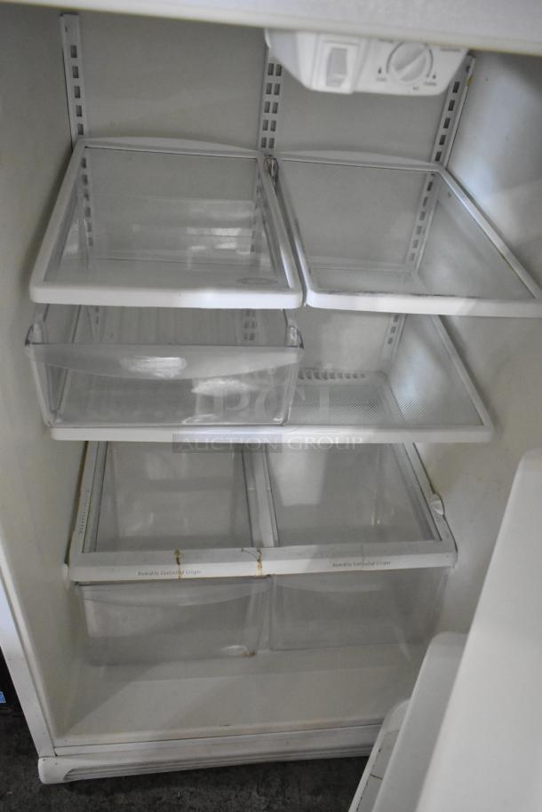 Electrolux FRT21IL6JW2 cooler with freezer, white interior, multiple shelves, thermostat control, good condition.