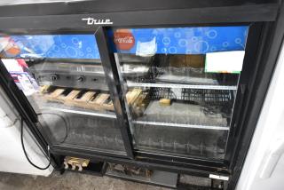 2017 True GDM-41SL-48-HC-LD commercial cooler, 2 glass doors, poly-coated racks, 115V, clean condition, visible branding.