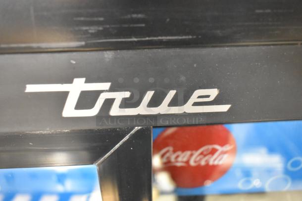 2017 True GDM-41SL-48-HC-LD cooler, metal frame. True logo visible. Used, 2-door, commercial cooler with poly-coated racks.