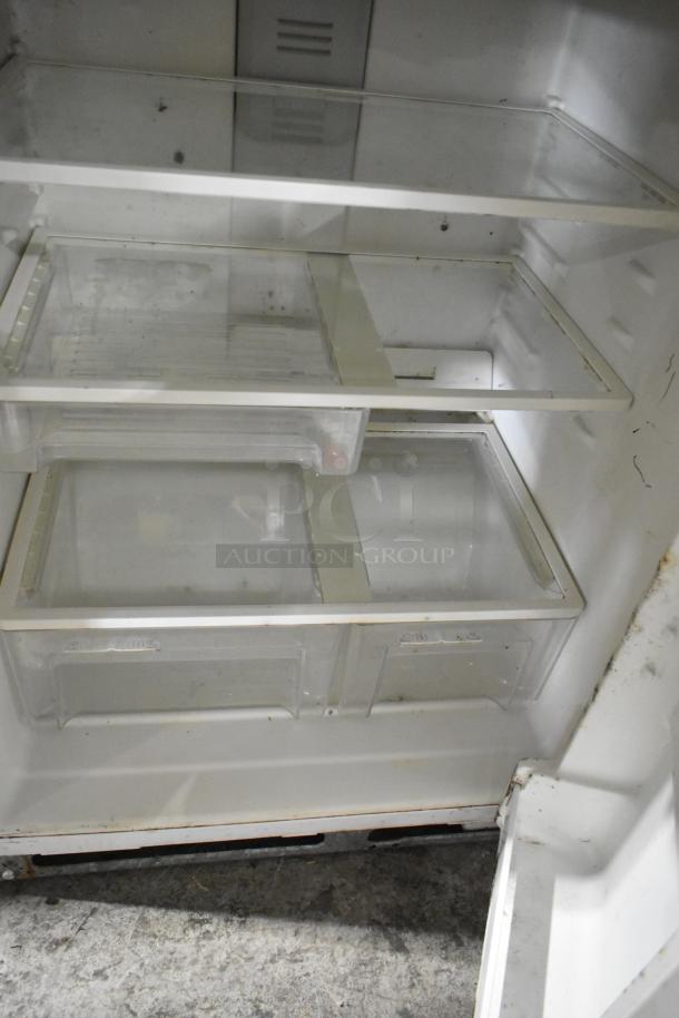 Maytag M1TXEGMYW01 reach-in cooler with freezer, visible interior shelves and storage drawers, 115V, 1 phase.