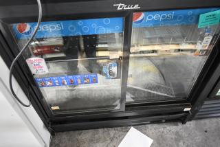 2017 True GDM-41SL-48-HC-LD commercial cooler, 2 glass doors, Pepsi branding, poly-coated racks, 115V, 1 phase.