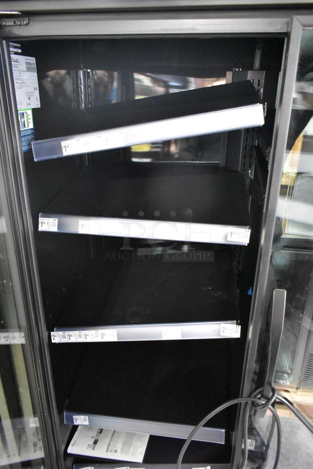 2024 True TVM-48SL-HC 2-door cooler merchandiser with metal racks, 115V, tags show 1 Phase, ideal for commercial use.
