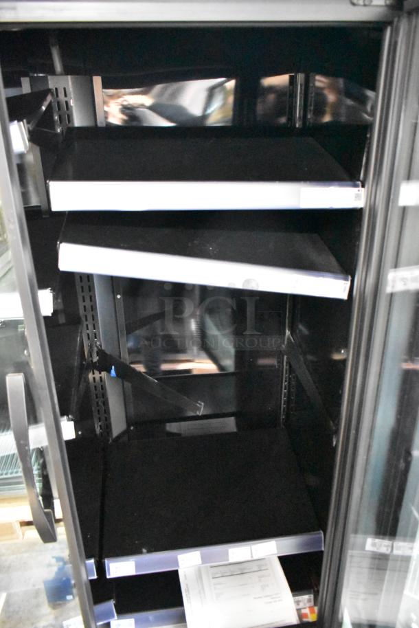 2024 True TVM-48SL-HC two-door commercial cooler with metal racks, 115 volts, 1 phase. Interior view, shelves empty.