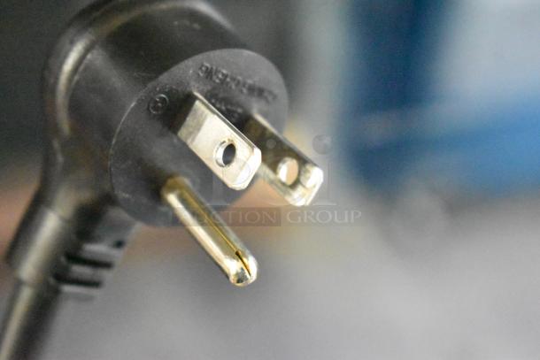 Close-up view of the plug for a 2024 True TVM-48SL-HC 2 Door Reach In Cooler, 115 Volts, 1 Phase.