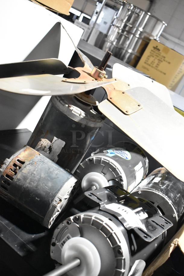 5 US Motors condenser fan motors, 208-230/460 volts, mixed condition, with visible labels and mounting brackets.