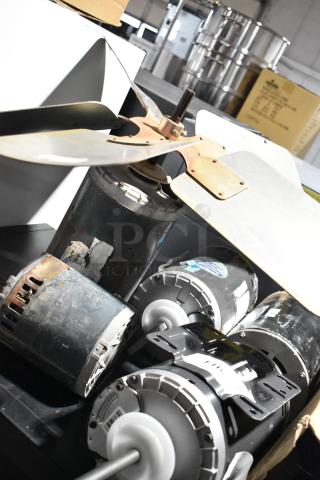 5 US Motors condenser fan motors, 208-230/460 volts, mixed condition, with visible labels and mounting brackets.