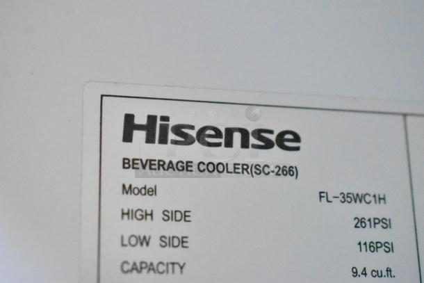 Hisense FL-35WC1H label showing model, pressure, and capacity details. High side 261PSI, low side 116PSI, 9.4 cu.ft.