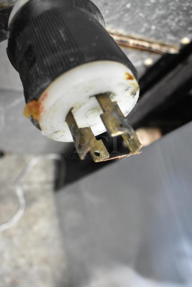 Close-up of a plug from the Garland Commercial Gas Powered Griddle. Image highlights the plug condition.