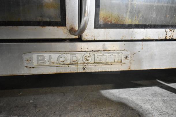 Blodgett EF-111 stainless steel commercial convection oven with view-through doors, visible wear, Blodgett branding displayed.