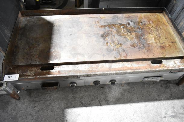 Garland stainless steel commercial countertop electric griddle, flat top, pre-owned with rust and wear, model details visible.