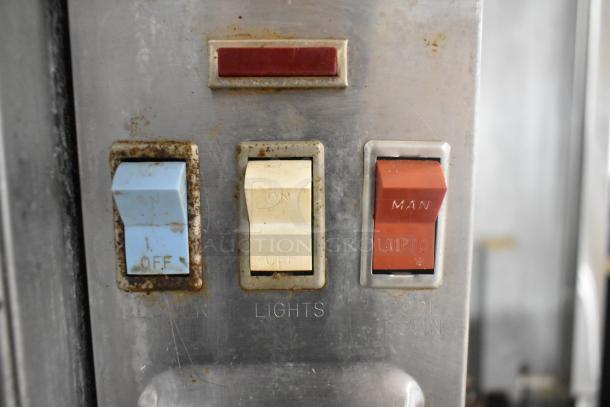 Blodgett EF-111 convection oven control panel with switches marked "On/Off," "Lights," and "Man/Auto."