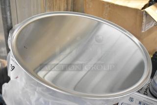 Brand new metal round baking sheet showing minor dents. Sold in a lot of 20, perfect for bulk purchase.