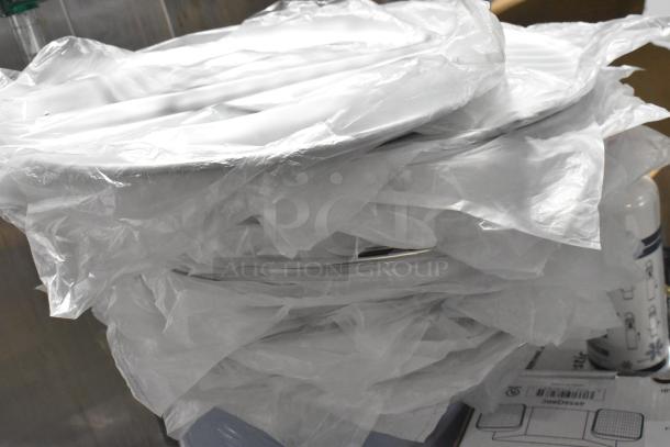 20 new metal round baking sheets in original packaging, scratch and dent condition, bulk purchase.