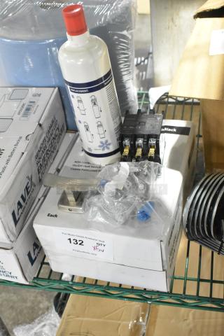 Five brand new scratch and dent items including a plastic hand dryer and Manitowoc cartridge. Items on shelves with visible labels.