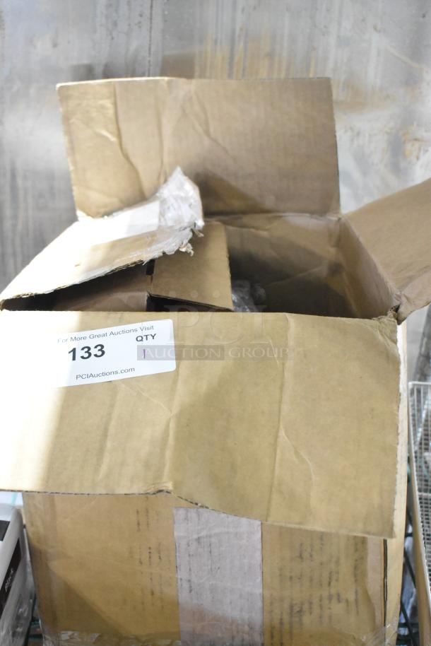 Open box labeled "133" showing a brand new scratch and dent cable. Cardboard has visible wear. Auction at PCIAuctions.com.