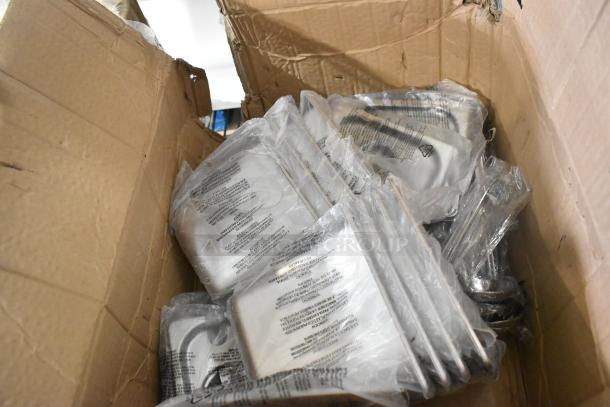 Box containing 12 new Bakers Lane baking pans and stainless steel drop-in bin lids, some with scratch and dent.