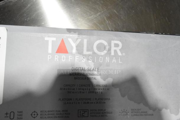 Brand new Taylor TE22OS 22 lb. digital portion control scale with oversized platform. Scratch and dent condition.