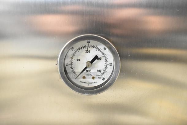 Stainless steel pressure gauge on Mainstreet 541HTUC30 undercounter dishwasher, showing PSI and KPA measurements, NSF certified.