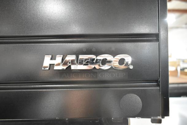 2019 Habco SE18 single door cooler, metal body. Door needs reattachment. Habco logo visible. 115V, 1 phase.