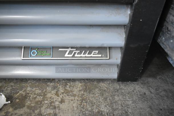 2021 True GDM-12-HC Cooler, single door, metal, poly coated racks, natural refrigerant label visible, used condition.