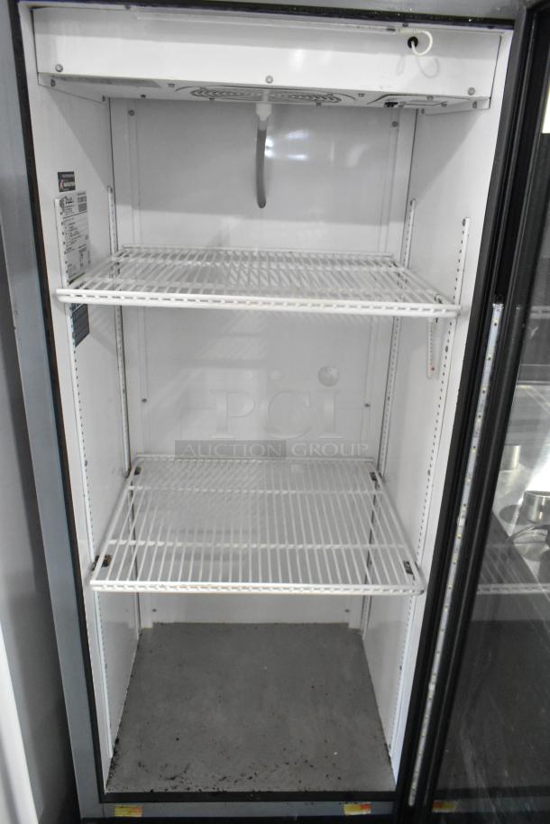 2021 True GDM-12-HC single door cooler with poly-coated racks, 115V, clean interior, minor wear.