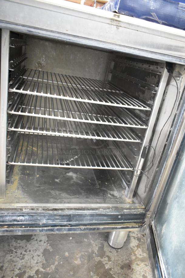 2021 Alto Shaam CTP7-20E stainless steel combi convection oven interior. Shelves visible, shows signs of use.