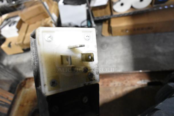 Close-up view of the plug of a 2023 Alto Shaam QC2-40 Stainless Steel Quickchiller. Plug condition appears used.