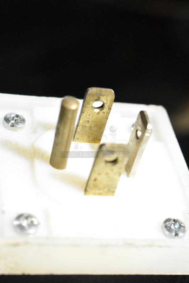Close-up of electrical plug prongs on a 2018 Randell BC-18 Stainless Steel Commercial Blast Chiller, model BC-18.