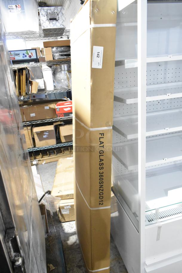 Brand new Avantco SNZGD12 71" flat glass sneeze guard, scratch and dent condition, in original packaging.