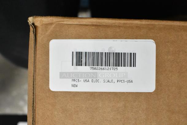 Brown box with label displaying barcode and "PPC5- USA ELEC. SCALE, PPC5-USA NEW." Contains Tor Rey PPC-5/10 scale.