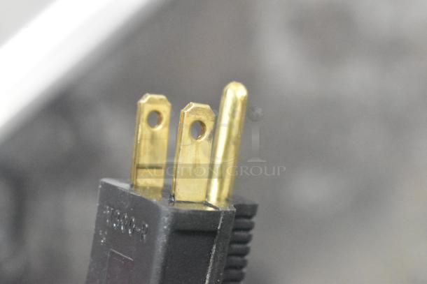 Close-up image of a three-prong power plug for the 2025 Pro-Cut KG-12-SS electric meat grinder, 115 volts, 1 phase.