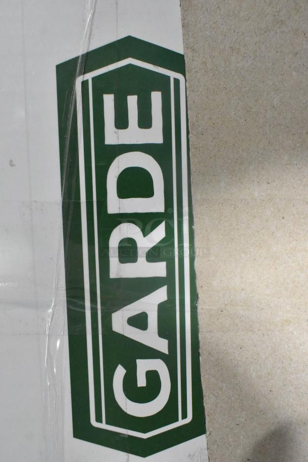 Brand new Garde MCJ-1 citrus juicer with minor scratches, branded packaging visible, model KG-12-SS, Pro-Cut make.