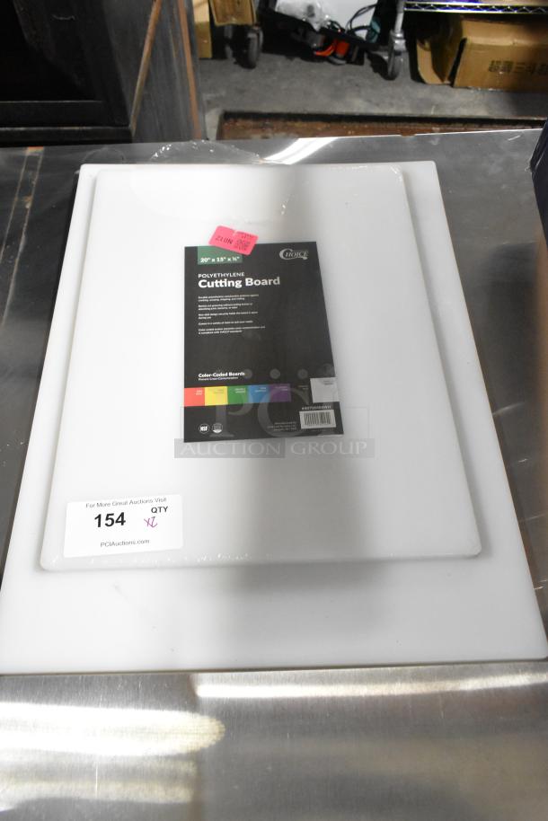 Two brand new 40720155WH Choice 20" x 15" x 1/2" white polyethylene cutting boards, labeled "scratch and dent", with auction tags.