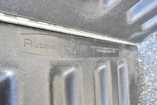 BRAND NEW Rubbermaid 1307 black poly lid for tilt truck. Visible branding and model number. Scratch and dent condition.