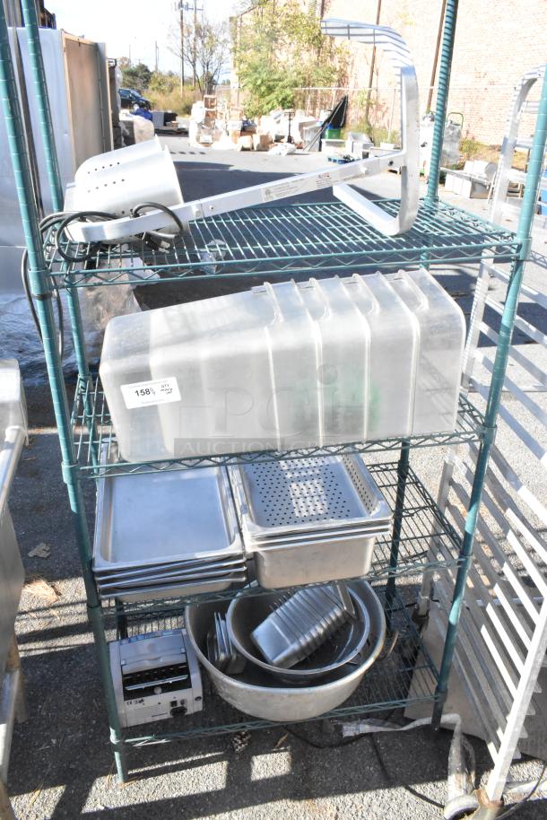 Green 4-tier shelving unit with poly bins, metal baking pans, and kitchen items. BUYER MUST DISMANTLE. Consider freight costs.