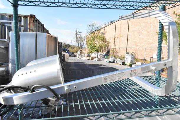 Green finish 4-tier shelving unit with poly bins and metal pans. Includes an Avantco W62 bulb food warmer. Buyer must dismantle.