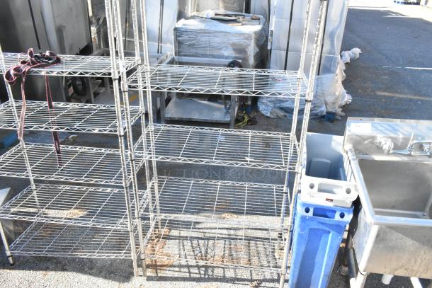 Chrome 4-tier wire shelving unit. Good condition. Buyer must dismantle. Freight charges apply.