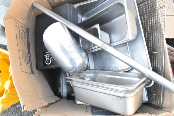 Pallet lot with metal stock pot, stainless steel drop-in bins, baking pan in used condition, visible in open cardboard box.